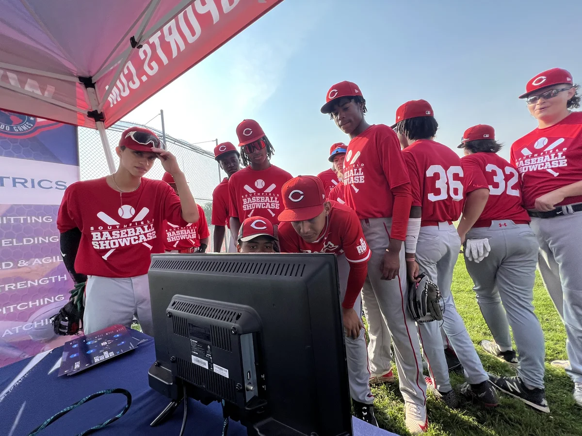 Baseball athletes viewing performance results at the testing booth