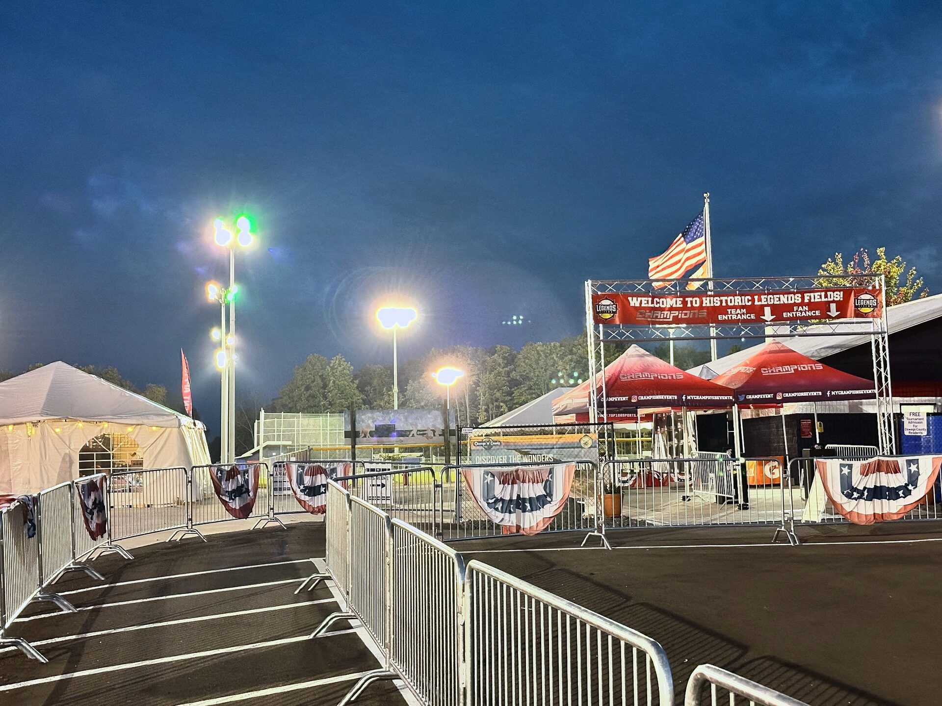 Historic Legends Fields entrance illuminated at night in Oswego